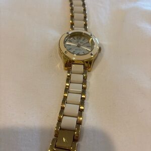 Anne Klein women’s white and gold tone link bracelet. 8